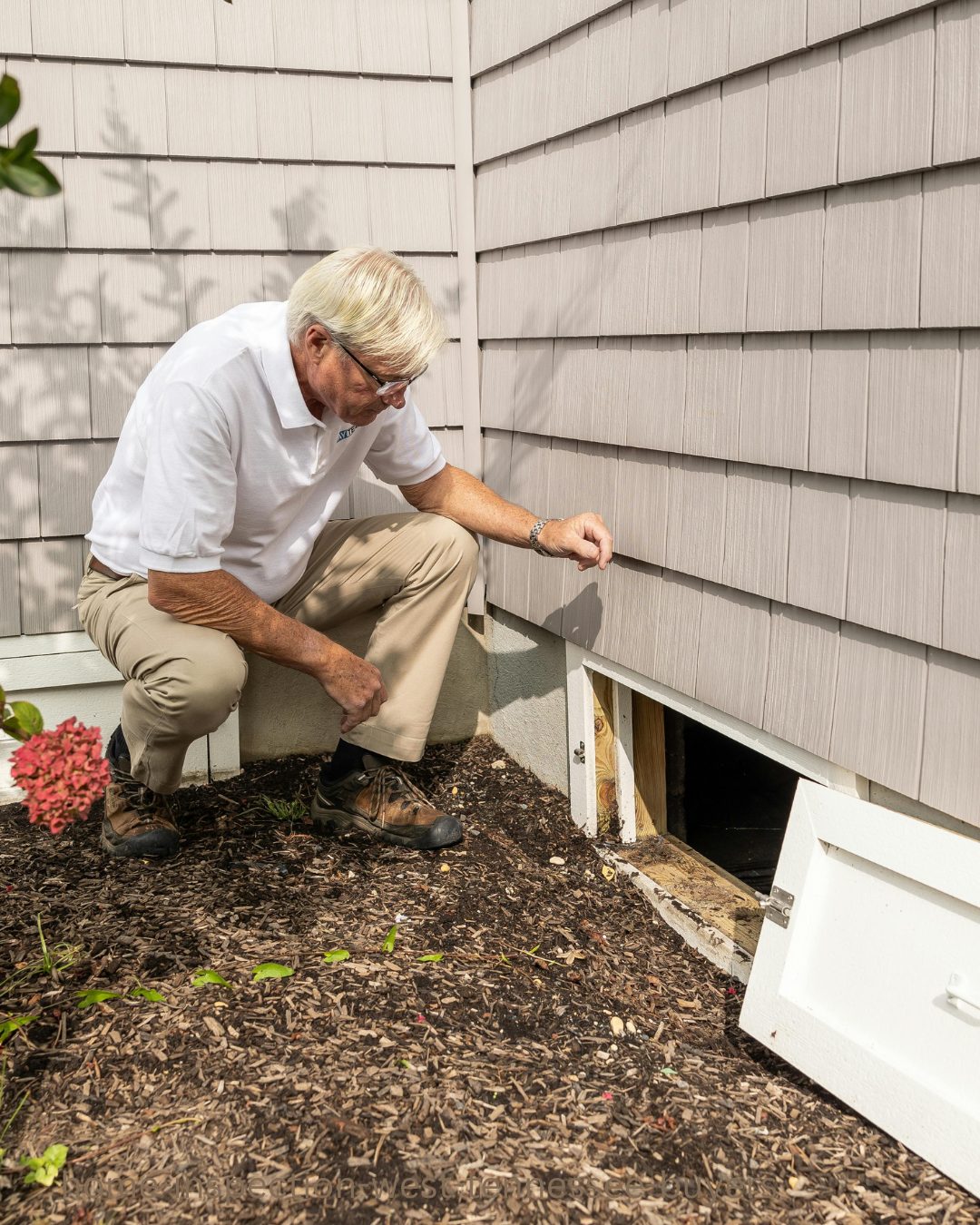 Professional home inspector evaluating a house during a home inspection in West Tennessee.