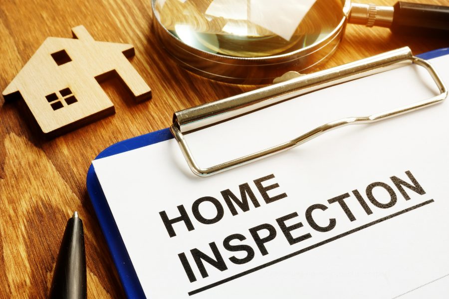 Home buyers reviewing a home inspection report during the home buying process.