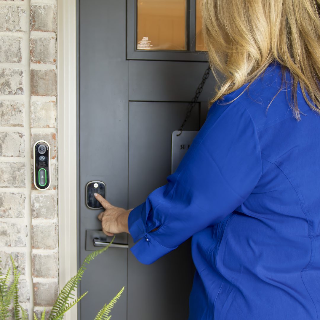 Jennifer Knolton, West Tennessee REALTOR, opening a front door for a client during a home showing